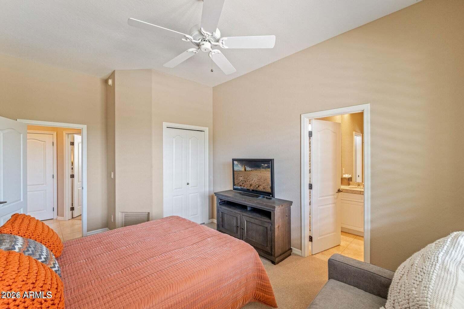 26601 North Aguila Road Rio Verde, AZ 85263 - Photo 30 of 45 a bedroom with a bed and a television