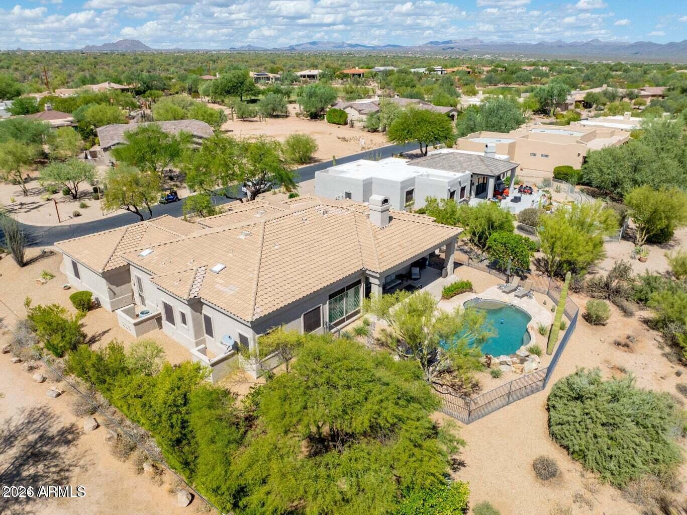26601 North Aguila Road Rio Verde, AZ 85263 - Photo 35 of 45 an aerial view of residential houses with outdoor space and parking