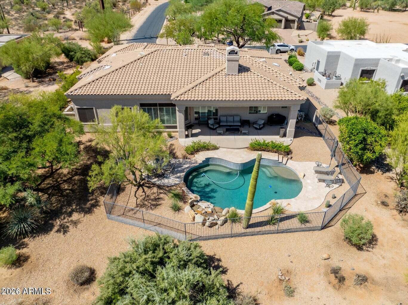 26601 North Aguila Road Rio Verde, AZ 85263 - Photo 4 of 45 an aerial view of a house with swimming pool and patio