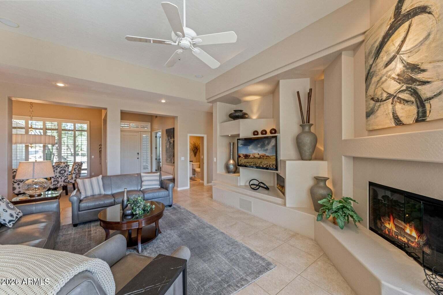 26601 North Aguila Road Rio Verde, AZ 85263 - Photo 8 of 45 a living room with furniture and fireplace