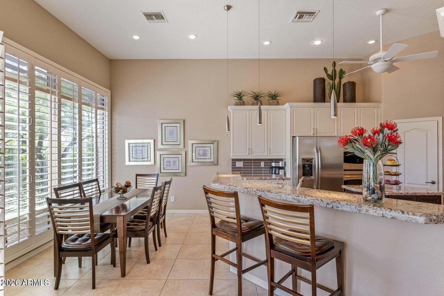 26601 North Aguila Road Rio Verde, AZ 85263 - Photo 9 of 45 a view of a dining room with furniture and a window
