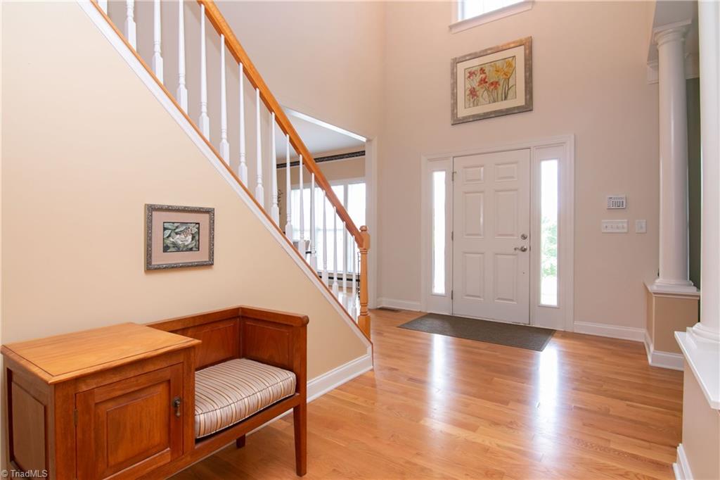8412 Chartwell Drive Oak Ridge, NC 27310 - Photo 2 of 30 A grand entrance awaits with beautiful gleaming hardwood floors