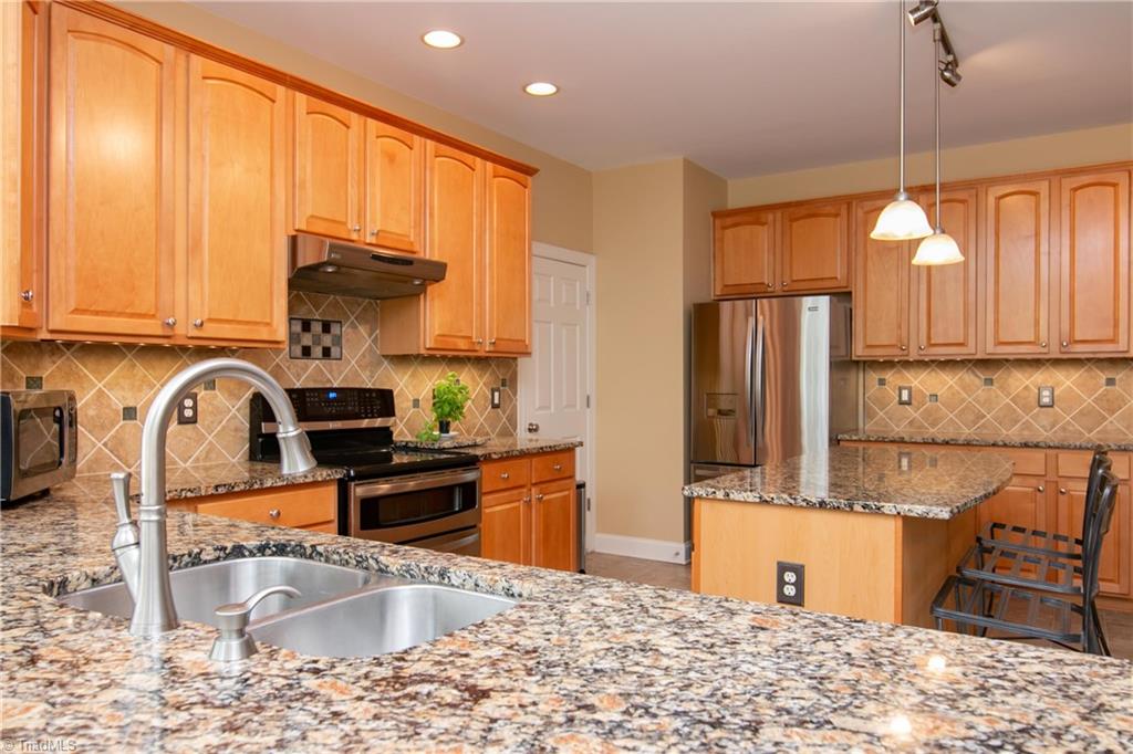 8412 Chartwell Drive Oak Ridge, NC 27310 - Photo 10 of 30 There are plenty of beautiful cabinets to store all your kitchen needs