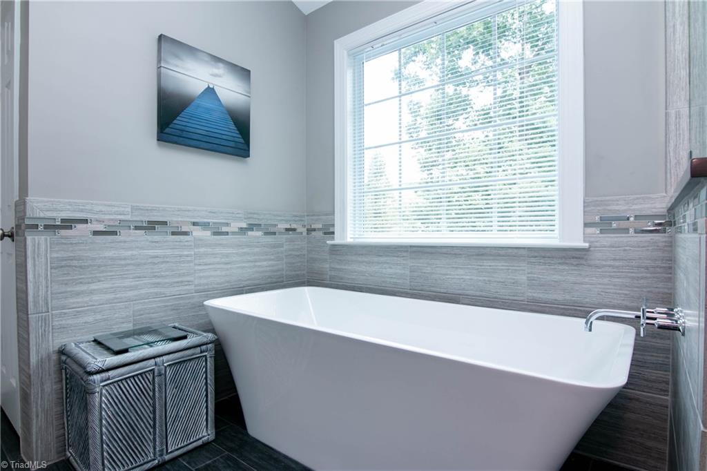 8412 Chartwell Drive Oak Ridge, NC 27310 - Photo 20 of 30 Gorgeous soaker tub and beautiful tile