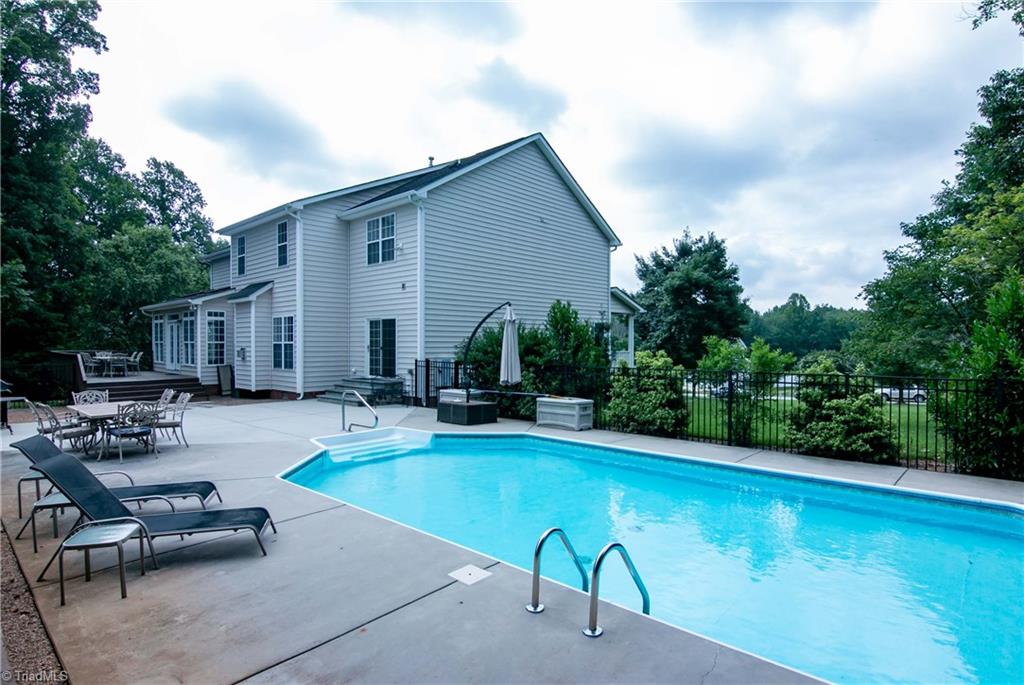 8412 Chartwell Drive Oak Ridge, NC 27310 - Photo 26 of 30 Enjoy coming home to relax in your salt water pool.