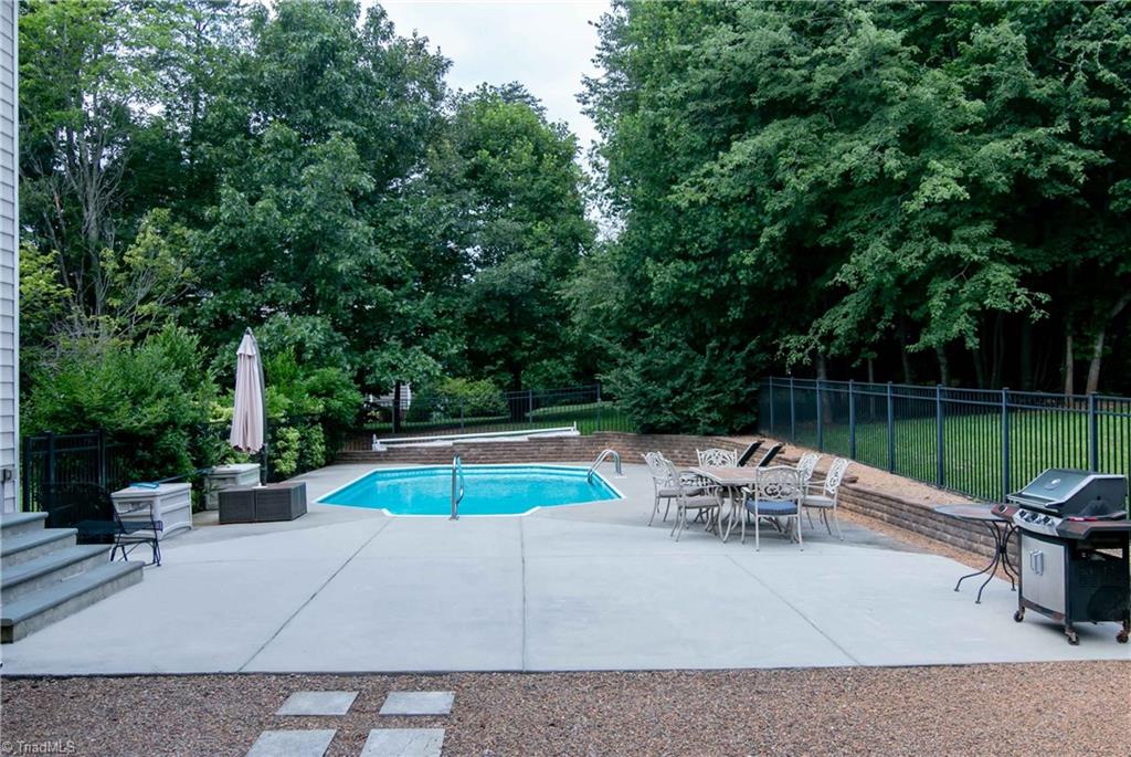 8412 Chartwell Drive Oak Ridge, NC 27310 - Photo 28 of 30 Extended patio area allows for plenty of room to entertain