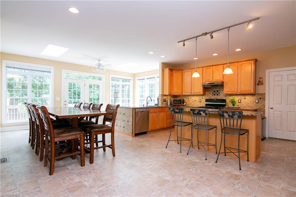 8412 Chartwell Drive Oak Ridge, NC 27310 - Photo 6 of 30 Room for everyone to gather in the large chef's kitchen