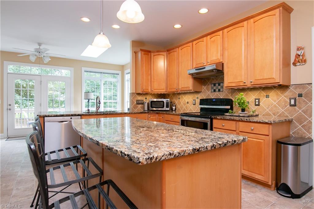 8412 Chartwell Drive Oak Ridge, NC 27310 - Photo 8 of 30 Stainless steel appliances, updated light fixtures and faucet