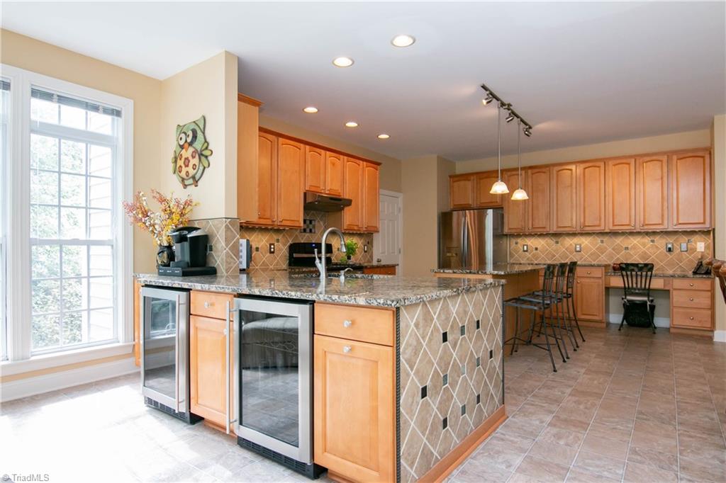 8412 Chartwell Drive Oak Ridge, NC 27310 - Photo 9 of 30 Two wine refrigerators and coffee bar