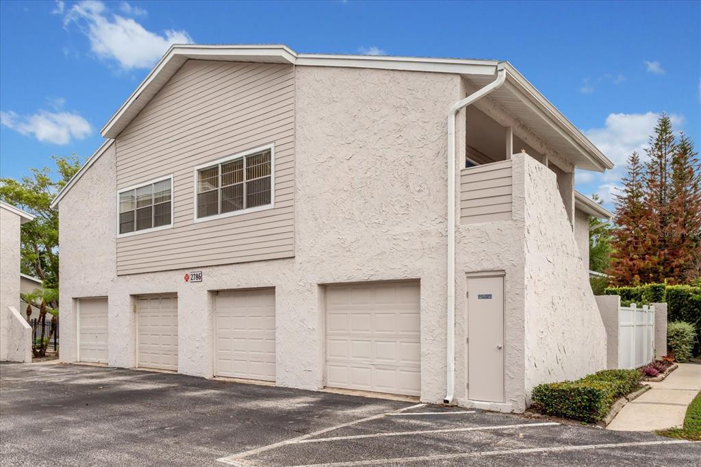 a front view of a house with garage