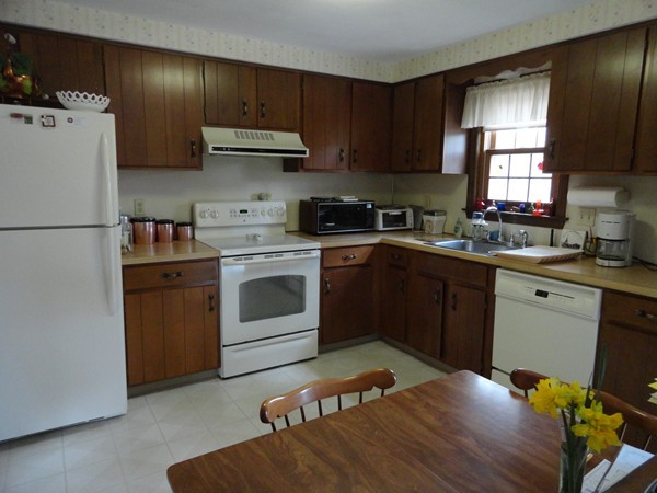 17 Michael Road Maynard, MA 01754 - Photo 13 of 20 a kitchen with a white stove top oven and refrigerator