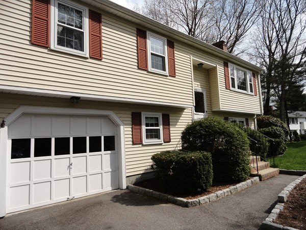 17 Michael Road Maynard, MA 01754 - Photo 19 of 20 a view of a house with a large window and potted plants