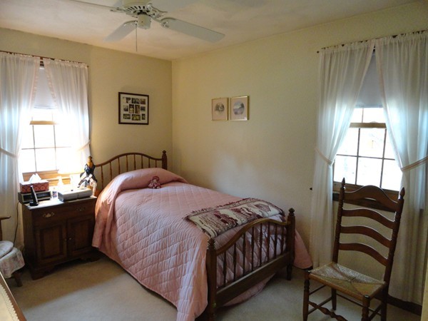 17 Michael Road Maynard, MA 01754 - Photo 8 of 20 a bedroom with a bed and a chandelier