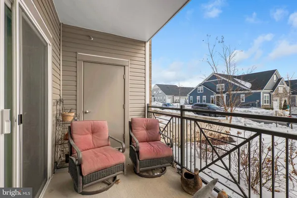 a view of a balcony with furniture