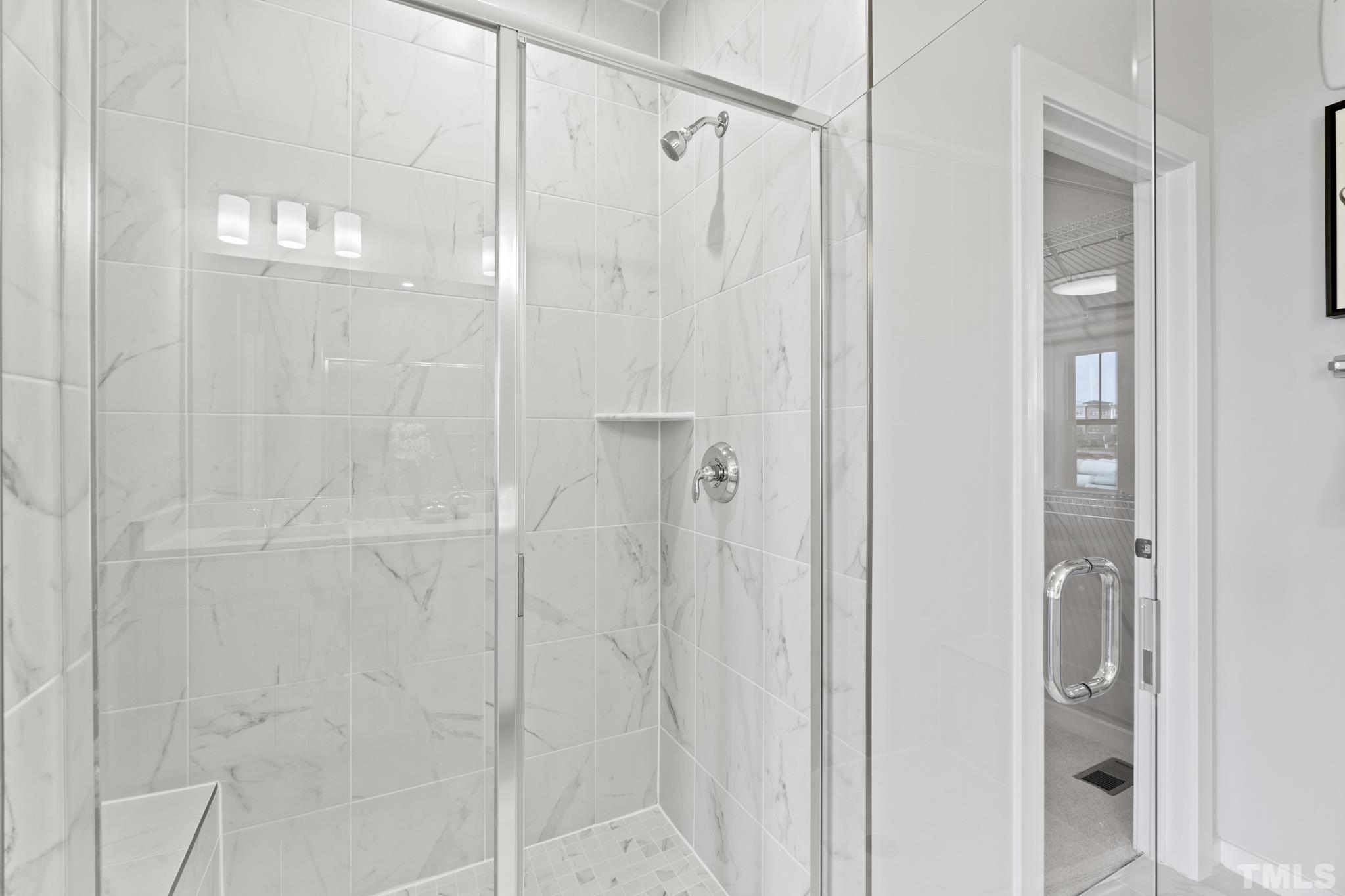 415 Wait Avenue, Unit 100 TESSA Wake Forest, NC 27587 - Photo 14 of 29 a bathroom with a shower