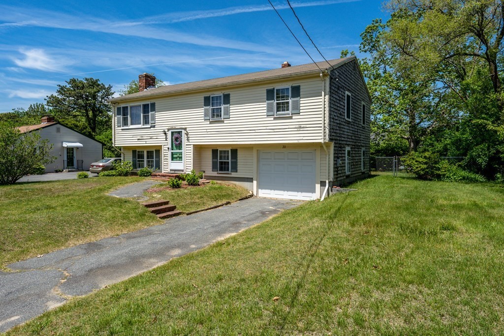 20 Alicia Road Barnstable, MA 02601 - Photo 1 of 24 a front view of a house with a yard