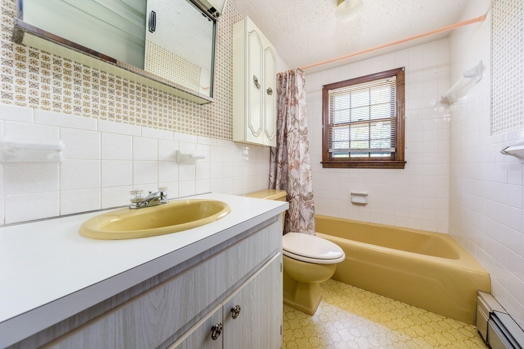 20 Alicia Road Barnstable, MA 02601 - Photo 15 of 24 a bathroom with a sink and a bathtub