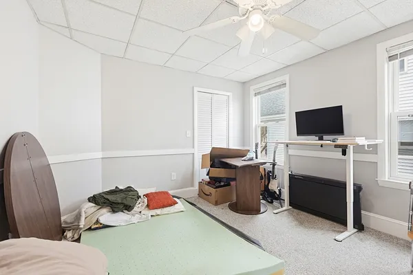 a room with furniture and a flat screen tv