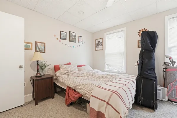 a bedroom with a bed and a closet