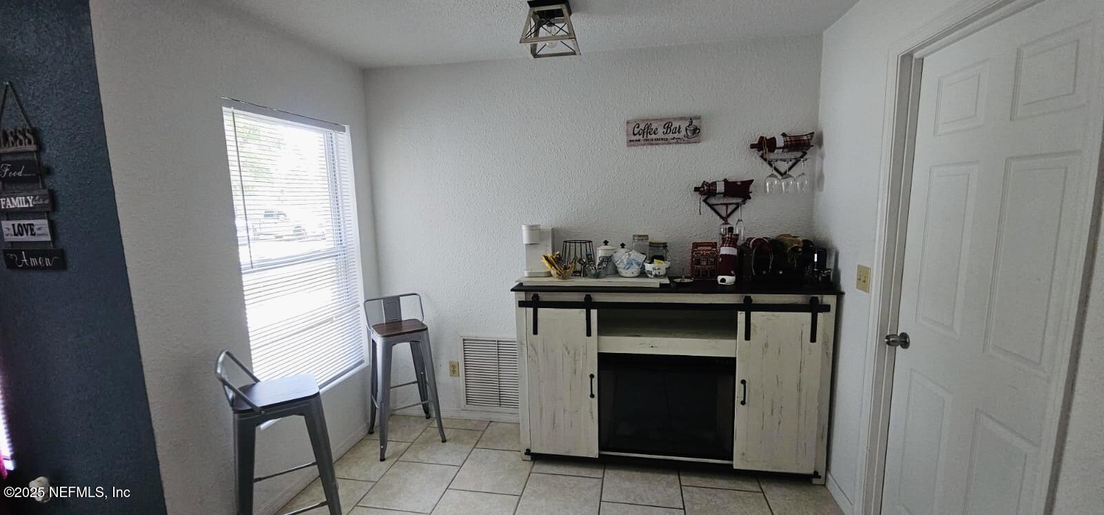 12961 5 Churches Road Sanderson, FL 32087 - Photo 16 of 34 a room with furniture and a fireplace