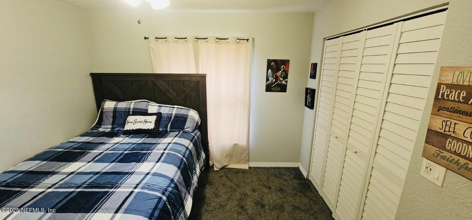 12961 5 Churches Road Sanderson, FL 32087 - Photo 23 of 34 a bedroom with a bed and a window