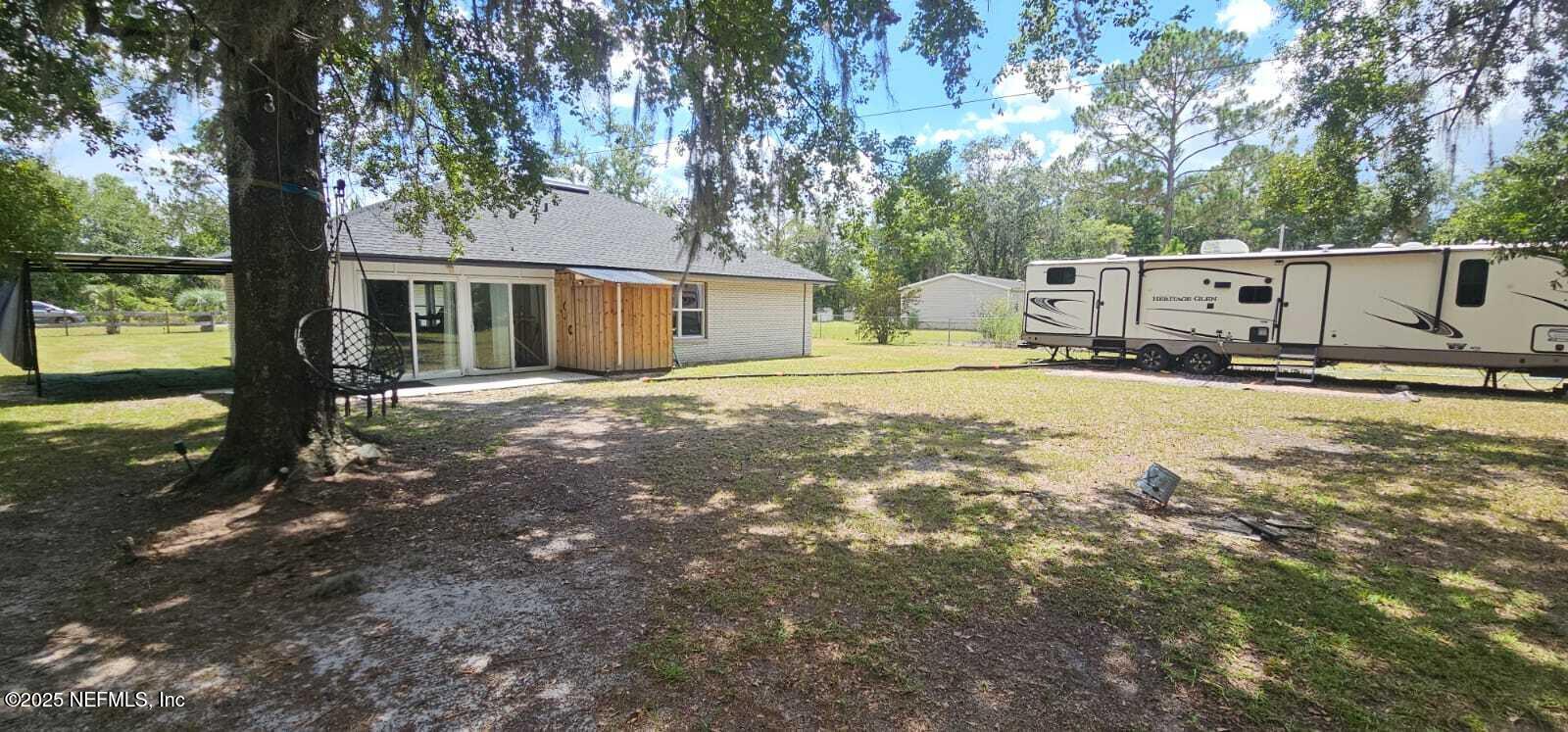 12961 5 Churches Road Sanderson, FL 32087 - Photo 29 of 34 a view of a house with a yard