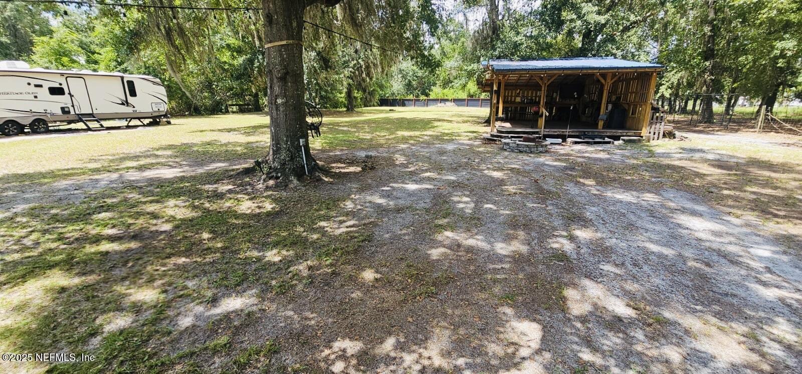 12961 5 Churches Road Sanderson, FL 32087 - Photo 33 of 34 a view of a house with backyard and trees