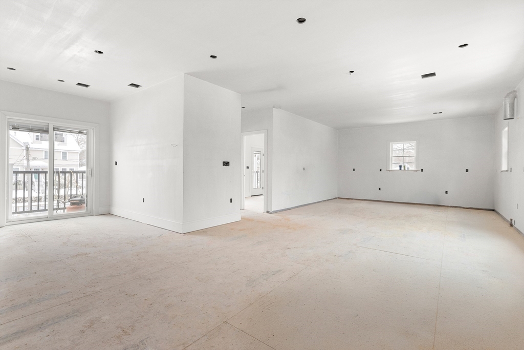 11 Washington Street, Unit 10 Ipswich, MA 01938 - Photo 36 of 41 an empty room with windows