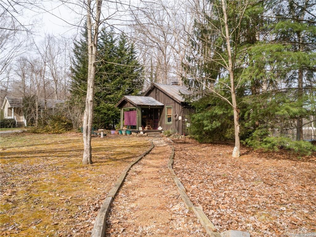 150 Oak Hill Road Candler, NC 28715 - Photo 12 of 25 a view of house with yard and tree in the background