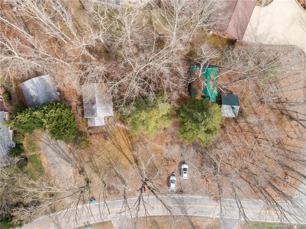 150 Oak Hill Road Candler, NC 28715 - Photo 16 of 25 a backyard of a house with lots of green space
