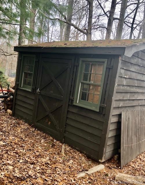 150 Oak Hill Road Candler, NC 28715 - Photo 20 of 25 a view of house with wooden door and chair