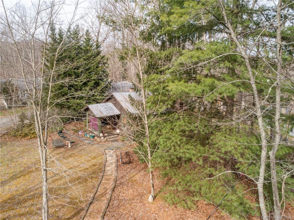 150 Oak Hill Road Candler, NC 28715 - Photo 3 of 25 a view of a yard with plants