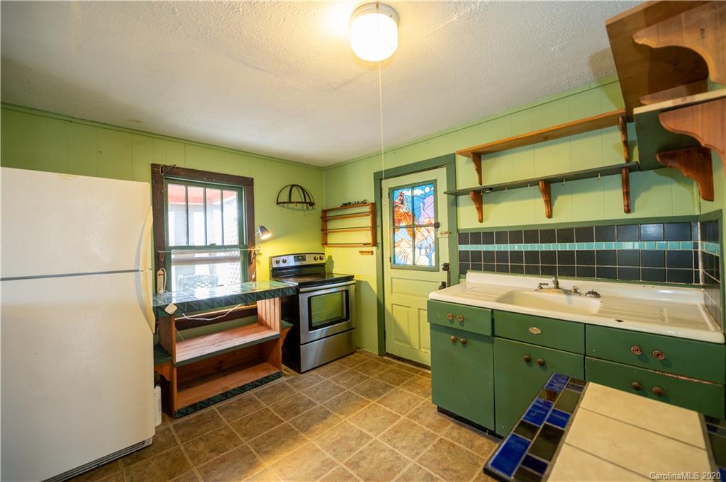150 Oak Hill Road Candler, NC 28715 - Photo 4 of 25 a view of kitchen with windows