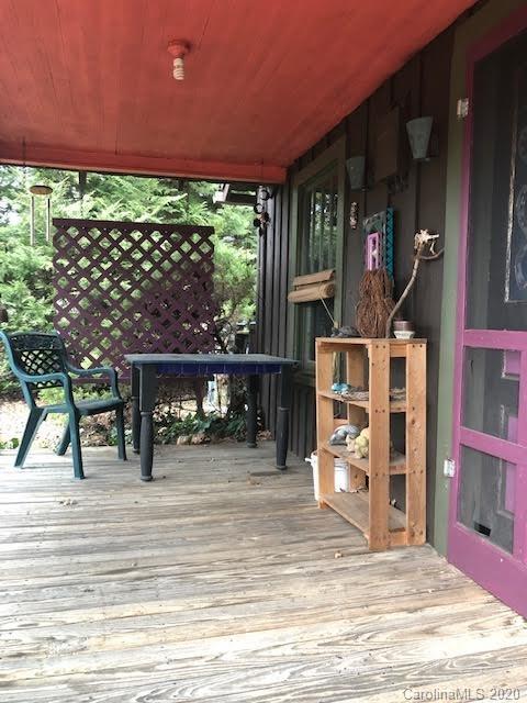 150 Oak Hill Road Candler, NC 28715 - Photo 9 of 25 a view of a balcony with chairs