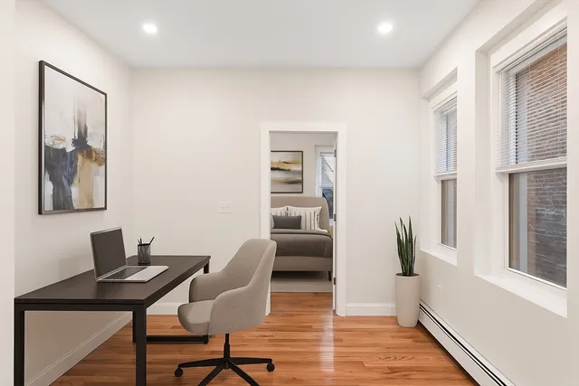 a workspace with furniture and window