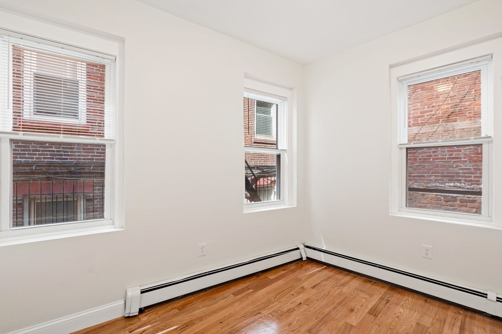 198 Salem Street, Unit 2 Boston, MA 02113 - Photo 17 of 21 an empty room with a window
