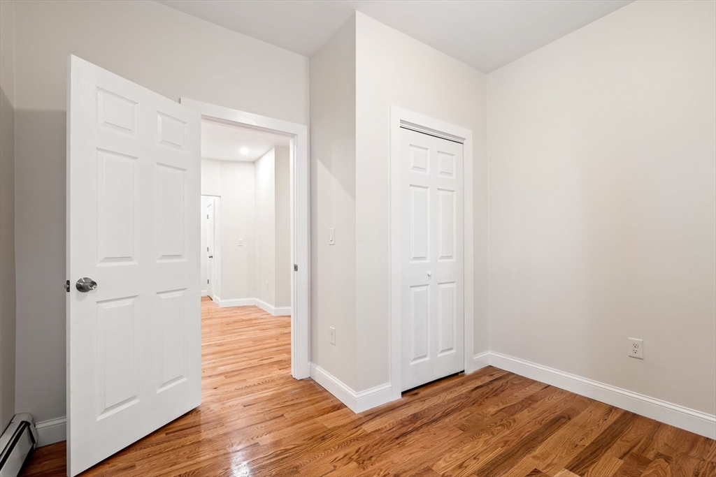 198 Salem Street, Unit 2 Boston, MA 02113 - Photo 18 of 21 a view of an empty room with wooden floor