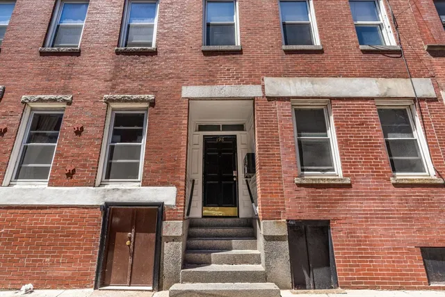 a building view with a brick wall