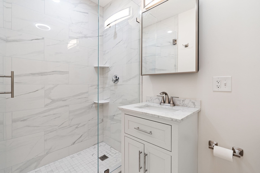 198 Salem Street, Unit 2 Boston, MA 02113 - Photo 10 of 21 a bathroom with a sink vanity granite and shower