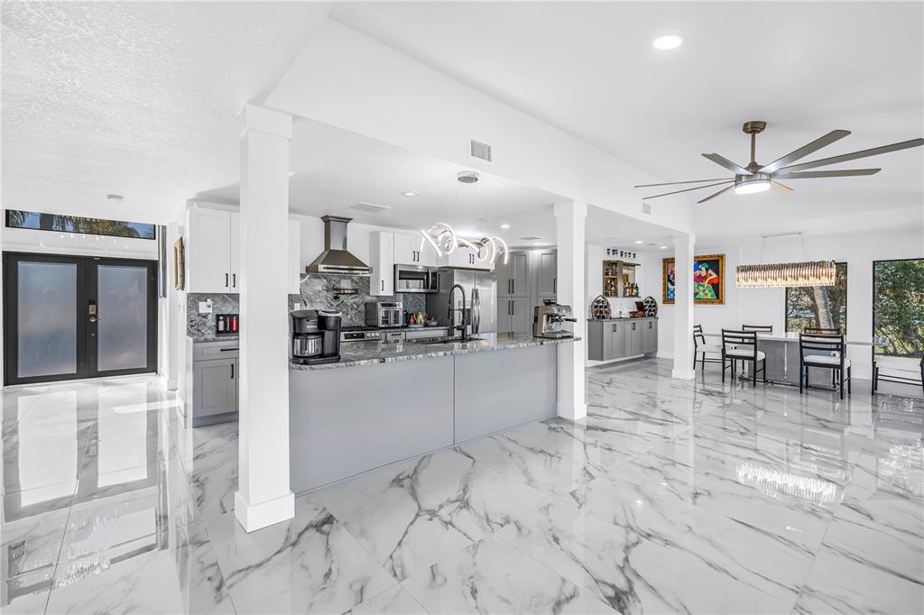 583 Crystal Drive Madeira Beach, FL 33708 - Photo 17 of 100 a view of a living room kitchen and a window