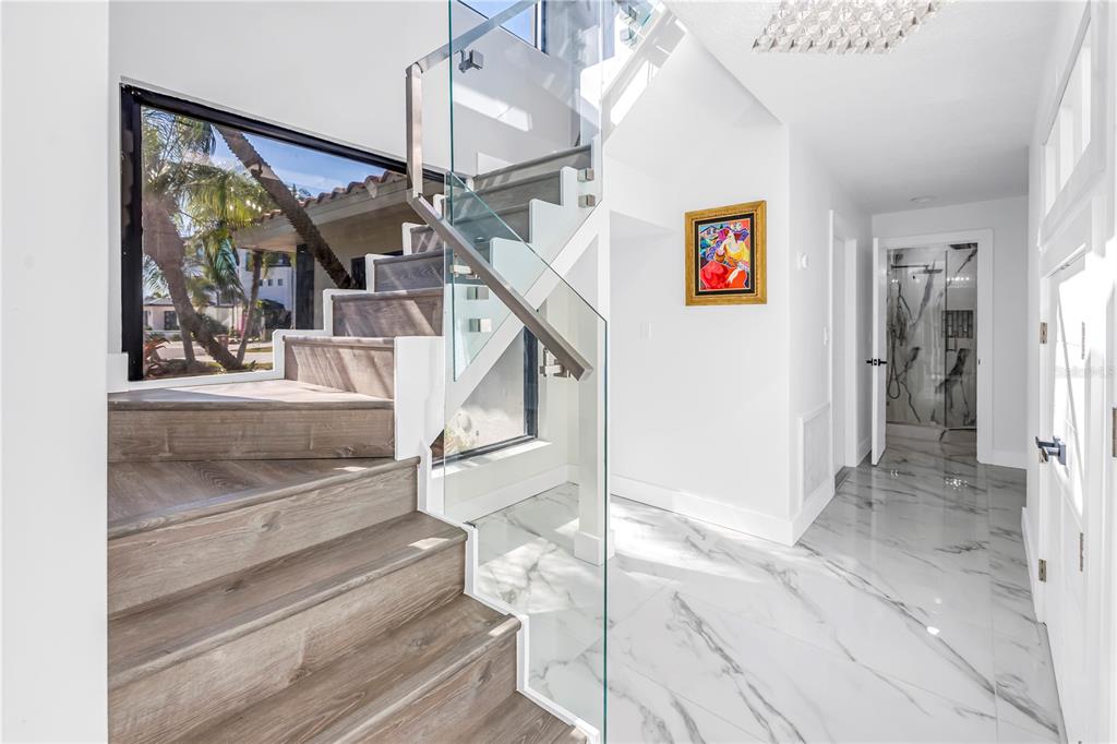 583 Crystal Drive Madeira Beach, FL 33708 - Photo 45 of 100 a view of entryway and hall with wooden floor