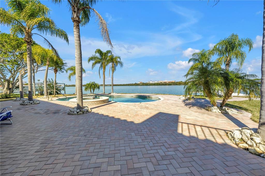 583 Crystal Drive Madeira Beach, FL 33708 - Photo 66 of 100 a view of a yard and palm trees
