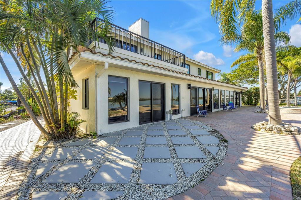 583 Crystal Drive Madeira Beach, FL 33708 - Photo 69 of 100 a view of a building with a yard