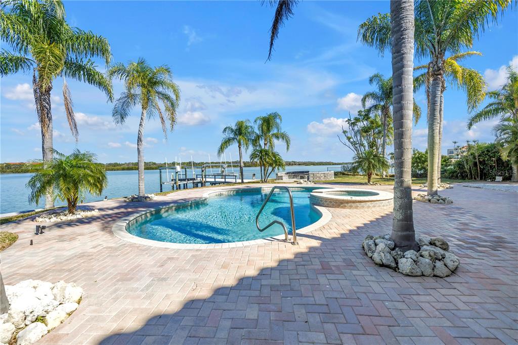 583 Crystal Drive Madeira Beach, FL 33708 - Photo 72 of 100 a view of a swimming pool with a patio
