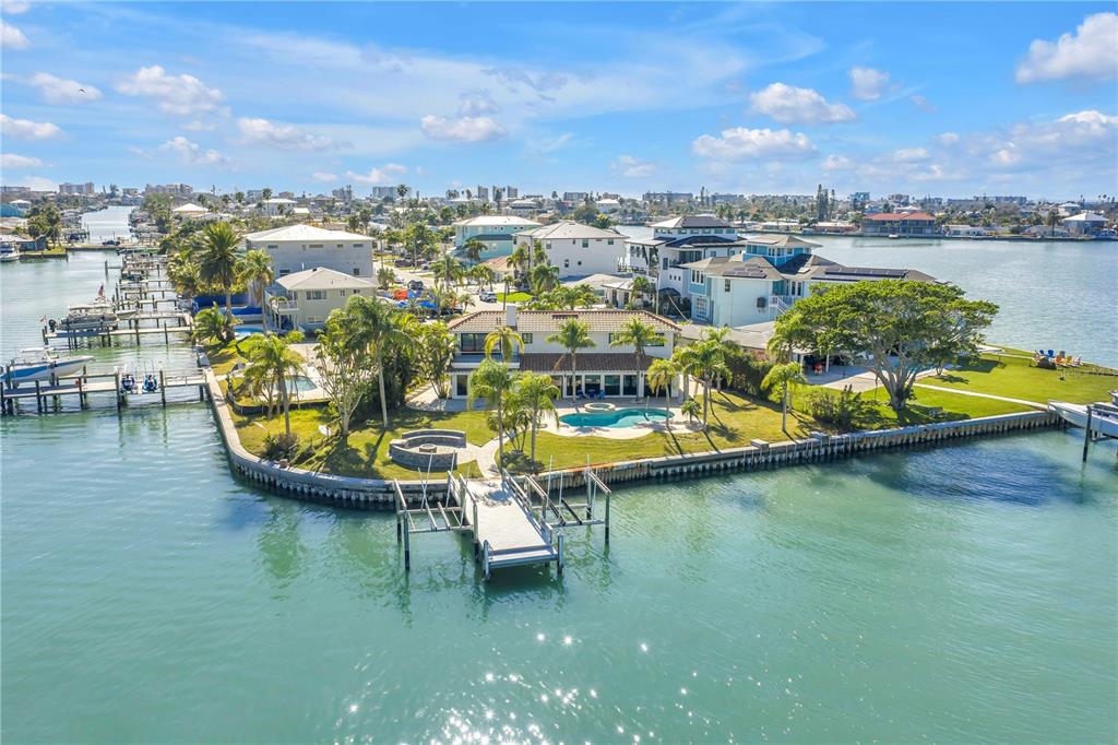 583 Crystal Drive Madeira Beach, FL 33708 - Photo 96 of 100 a view of a lake with a table and chairs