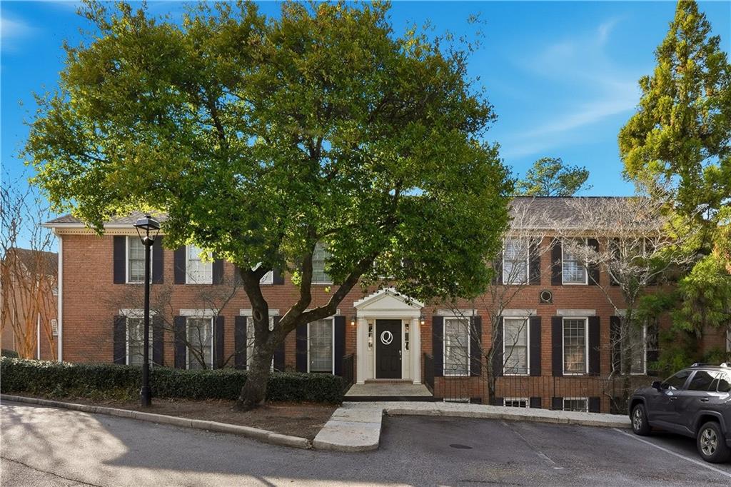 1101 Collier Road Northwest, Unit Q6 Atlanta, GA 30318 - Photo 15 of 20 front view of a house with a street