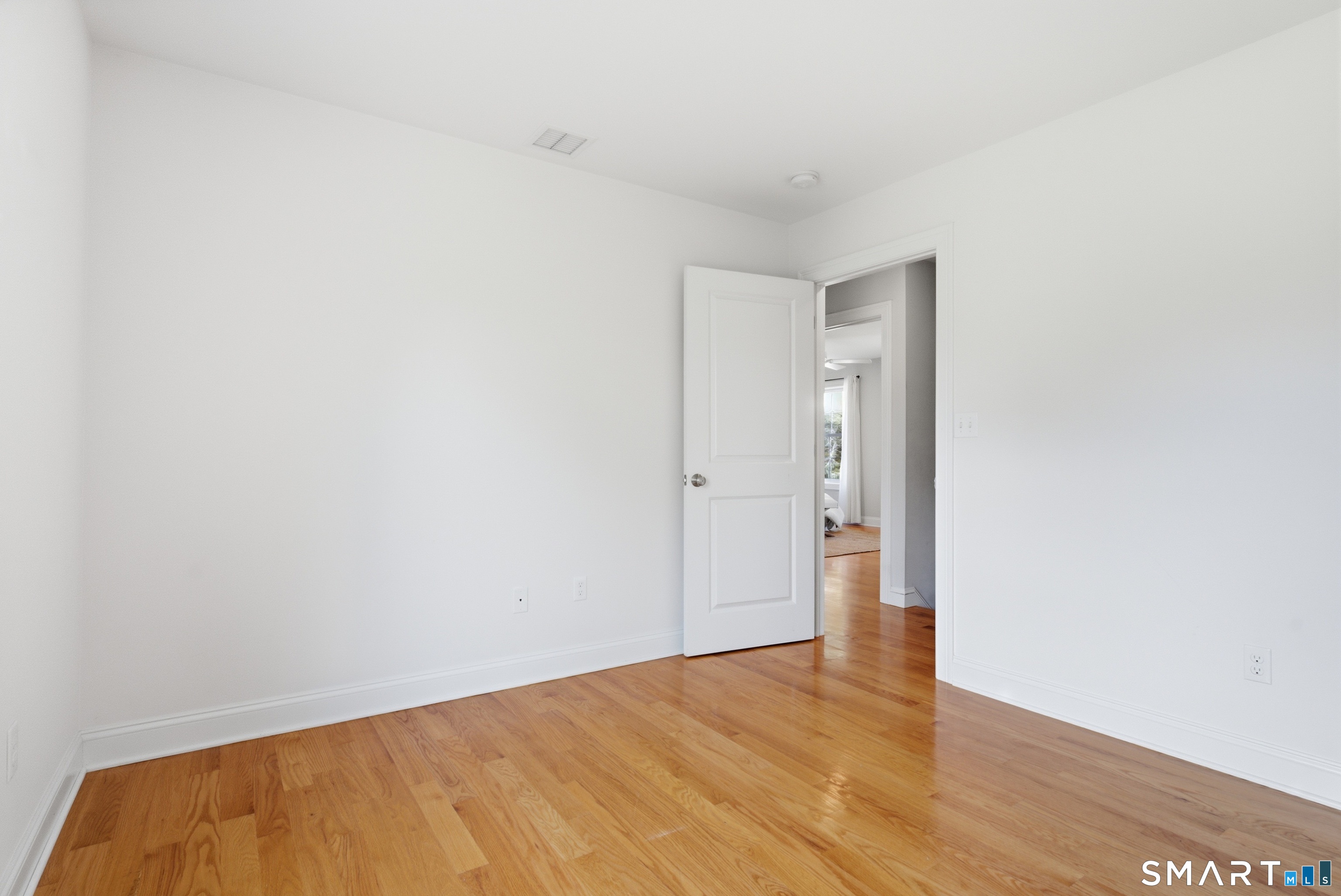 838 Little Meadow Road Guilford, CT 06437 - Photo 21 of 40 Bedroom 2 has hardwood floors and a ceiling fan