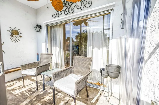 a view of a dining room with furniture wooden floor and a chandelier
