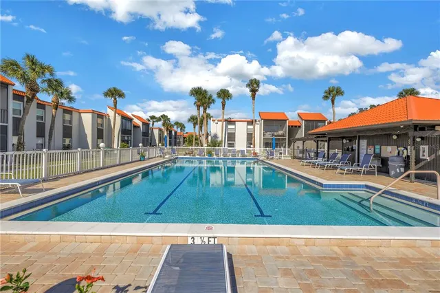 a view of houses with a swimming pool