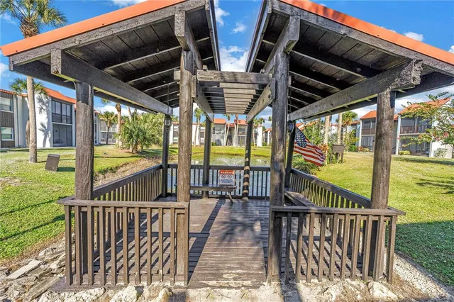 a view of a porch with wooden floor